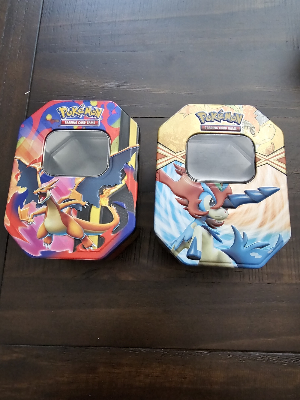 Pokemon Tin Set with Red Charizard & Blue Keldeo Art